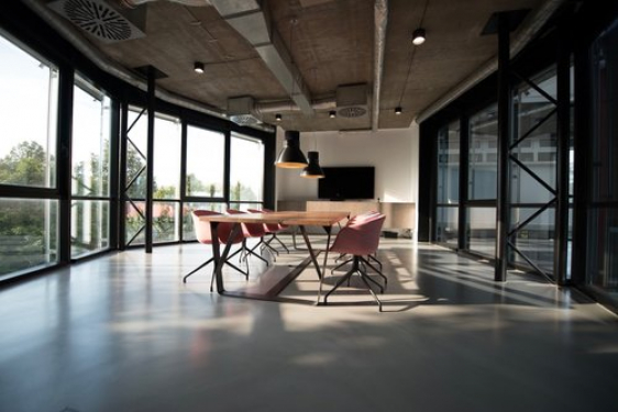 Spacious boardroom with a meeting table and advanced technologies